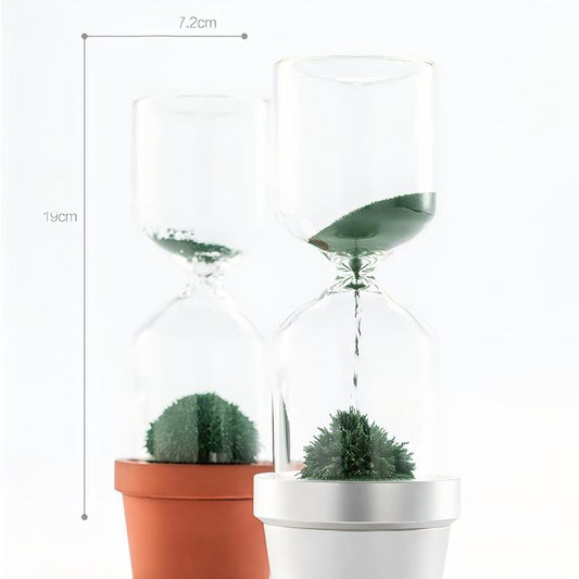 Glass hourglass with plants in pots, showing dimensions on a white background
