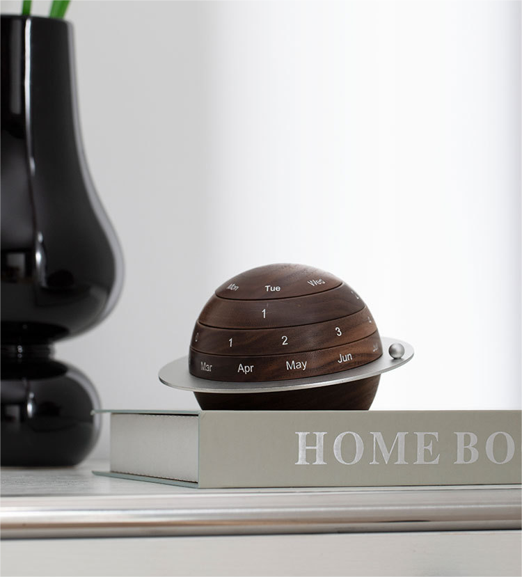 Black walnut rotating spherical perpetual calendar desk ornament