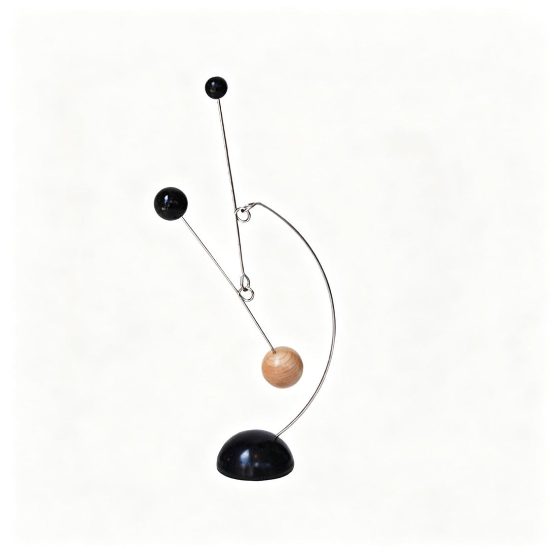 Kinetic balance mobile sculpture in wood and metal with three spheres