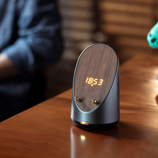 Proximity-sensing speaker, 15W wireless charger clock and phone stand 4-in-1 desk gadget
