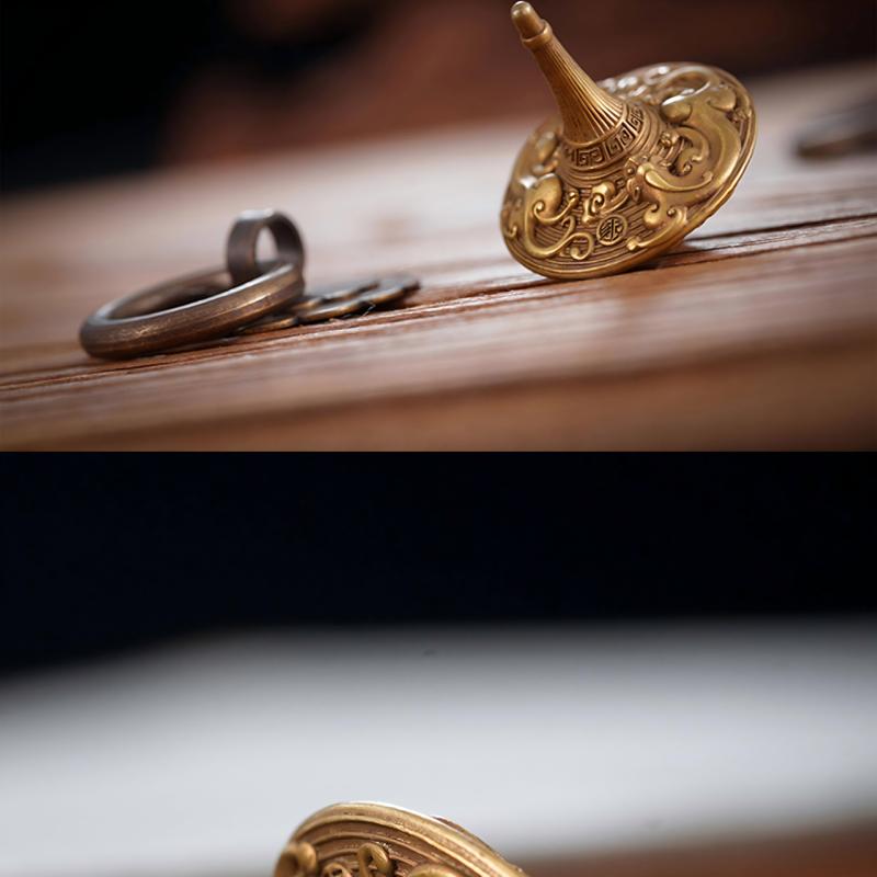 Brass Spinning Top | Premium Metal Fidget Toy | Stress Relief Desktop Gift displayed elegantly on a wooden surface.