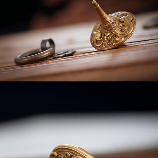 Brass Spinning Top | Premium Metal Fidget Toy | Stress Relief Desktop Gift displayed elegantly on a wooden surface.