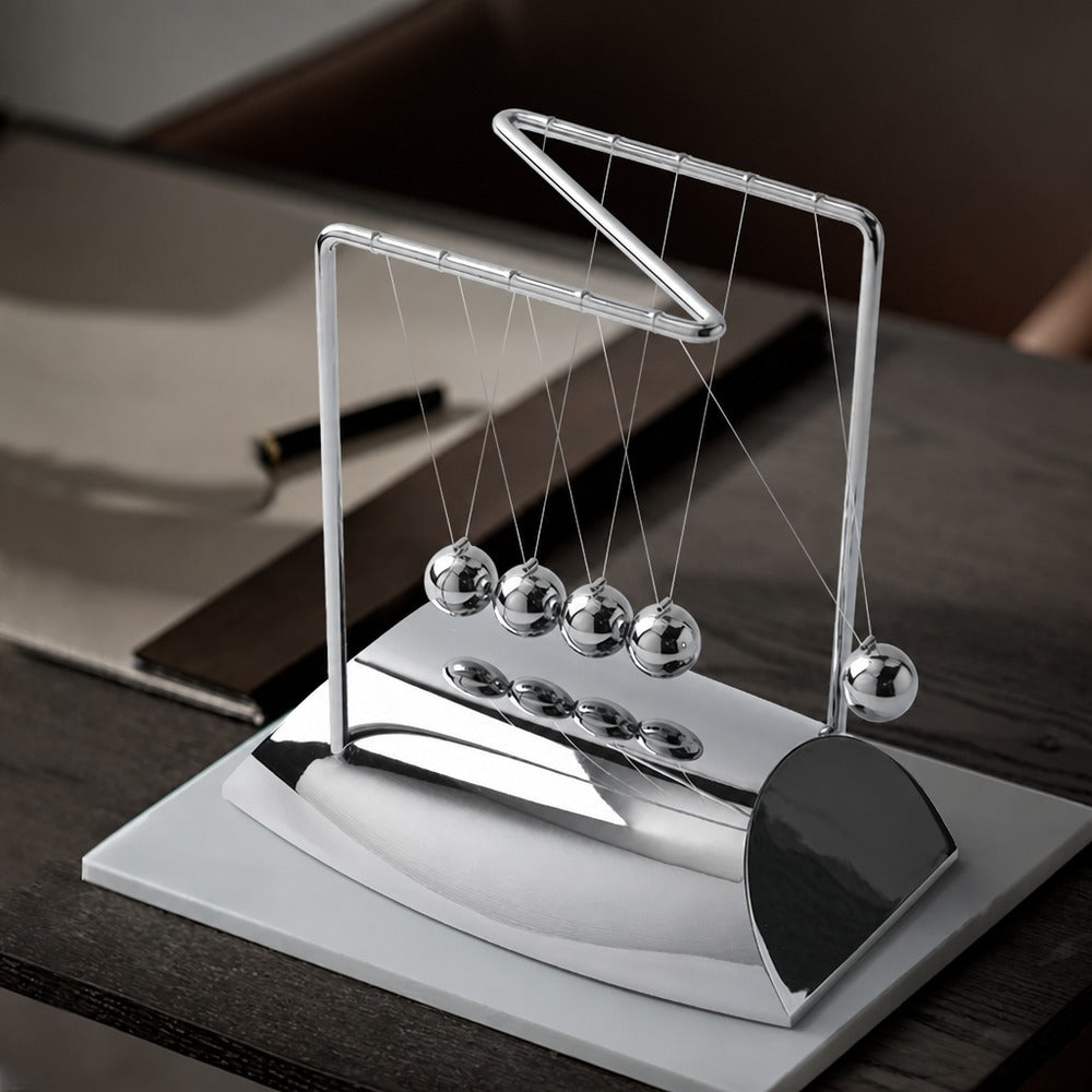 Newton's cradle and sand art desk set