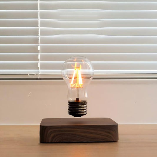 Light bulb on a wooden base in front of window blinds