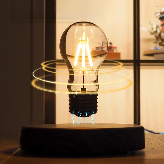 Light bulb on a black base with a blurred indoor background