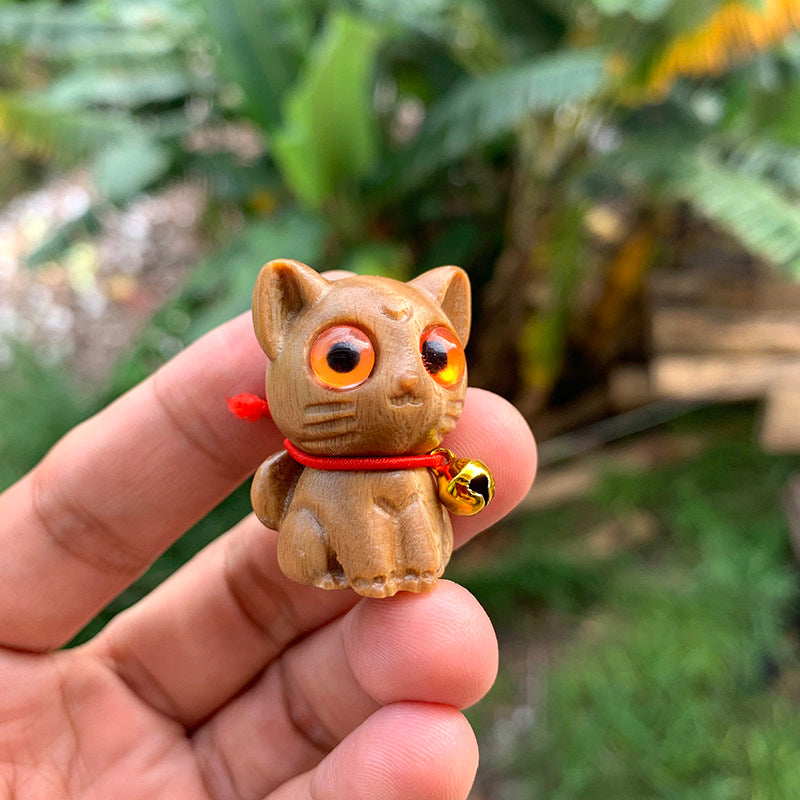 Ebony Wood Curious Cat Blind Box - blind box, cat figurine, desk decor - product in use