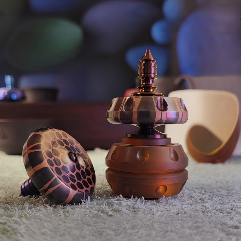 Titanium Niobium Fidget Spinner | Premium Metal Stress Relief Toy | Desktop Gift on a soft surface.