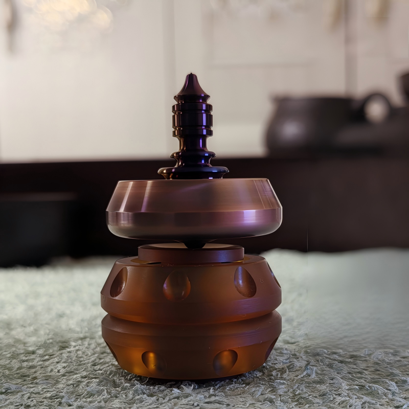 Titanium Niobium Fidget Spinner | Premium Metal Stress Relief Toy | Desktop Gift on a soft surface