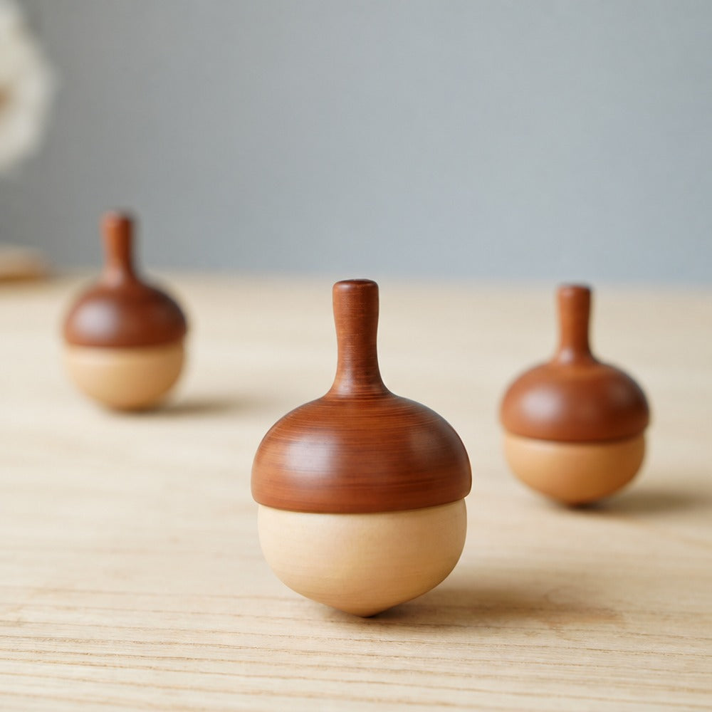 Wooden pinecone spinning top set