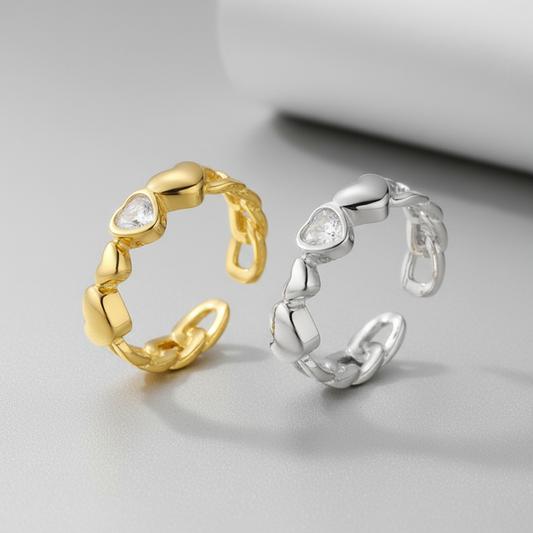 Two Heart Chain Rings on Pale Grey